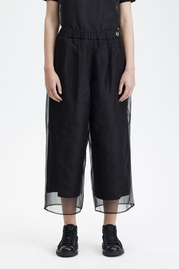 Pantalones con capa superpuesta transparente